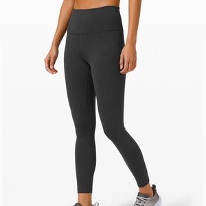 Grey Lululemon leggings with hole design on calf